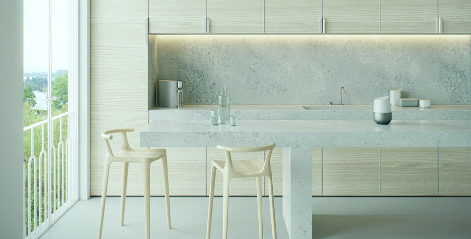 Modern minimalist kitchen with light-gray textured Airy Concrete quartz countertop and island against pale wood-grain cabinetry and a large window.