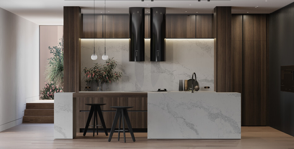 A large kitchen island in dove-white Statuario Maximus quartz contrasted by broad light-gray veining.