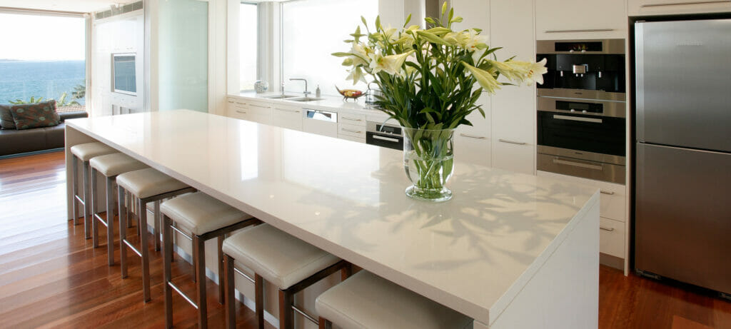 white kitchen with white quartz countertops