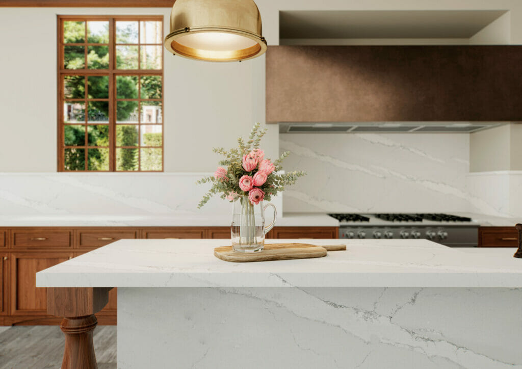 Kitchen with white quartz island and grey floors 