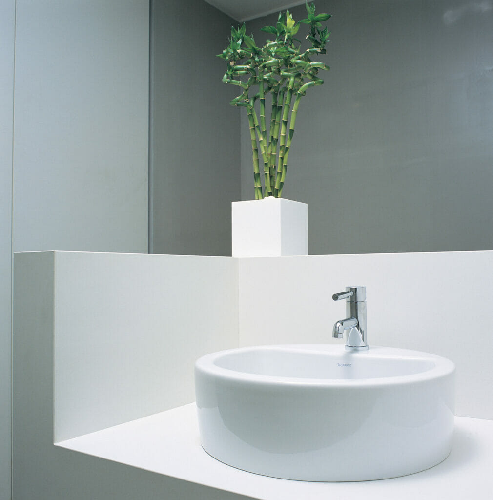 White bathroom with white counter and sink 