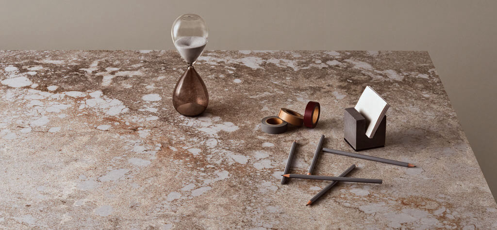 Modern multi-dimensional brown quartz countertop with miscellaneous items 