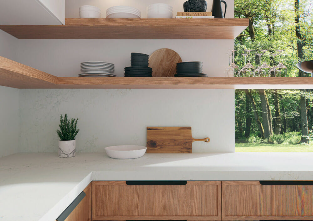 white kitchen countertop and backsplash with utensils
