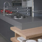 black kitchen with grey countertops