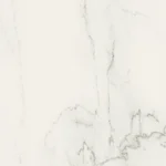 White marble surface with subtle gray and beige veining patterns.
