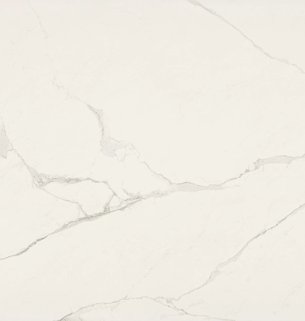 White marble surface with subtle gray veining and natural stone texture.