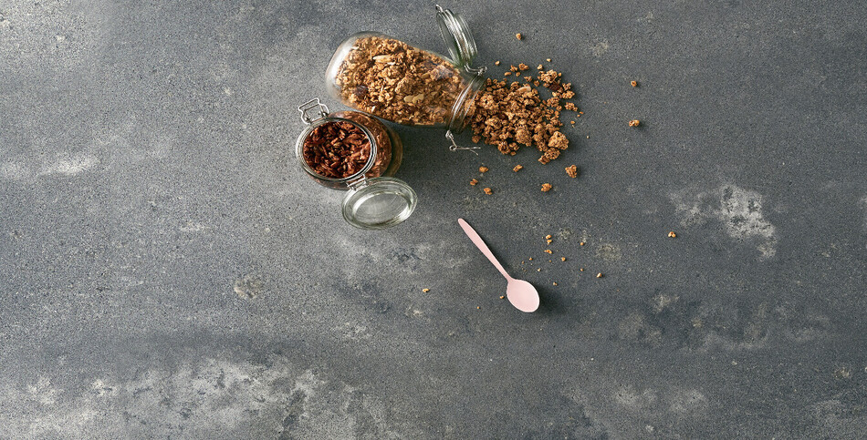 Close-up of Rugged Concrete quartz featuring robust gray gradients and industrial-inspired patina on a matte finish.